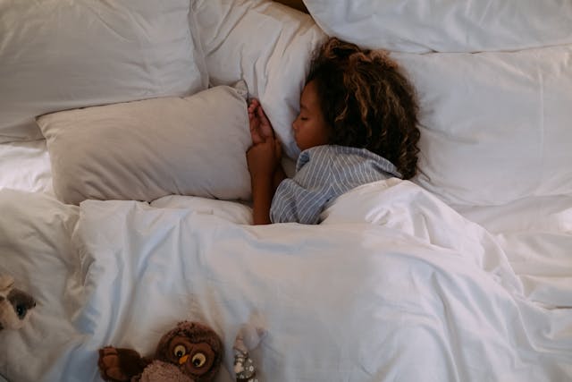 Child sleeping soundly due to a structured daycare routine at Paramus Daycare